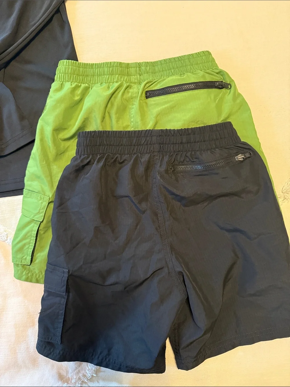Two sets, Nike rash guard/swim shorts, size small (boys 8-10)